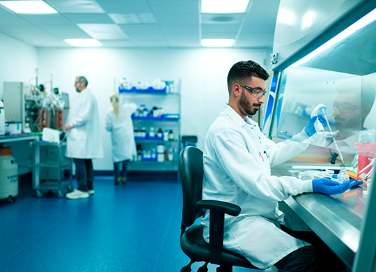 Researcher in cell and gene therapy labs preparing sample Researcher in cell and gene therapy labs preparing sample