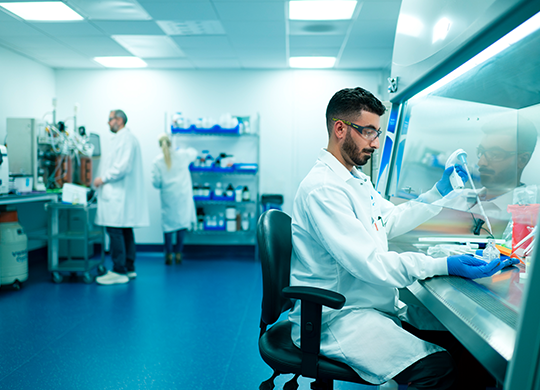 Researcher preparing samples in cell and gene therapy lab Researcher preparing samples in cell and gene therapy lab