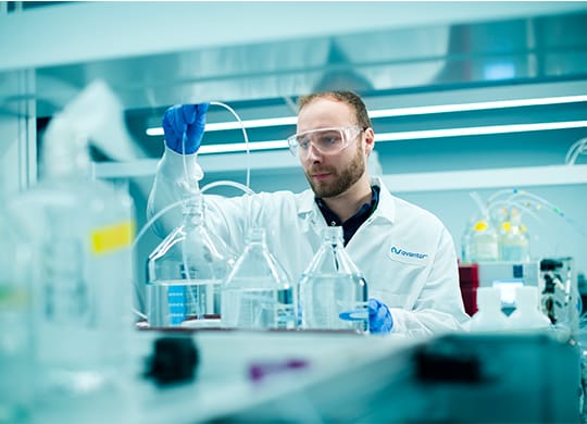 Researcher prepping analysis in downstream development lab Researcher prepping analysis in downstream development lab