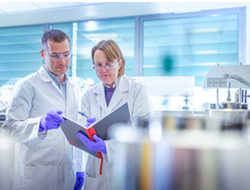 Two scientists in lab environment addressing current challenges in viral vector gene therapy manufacturing Two scientists in lab environment addressing current challenges in viral vector gene therapy manufacturing