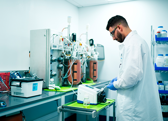 Process development scientist preparing viral vectors Process development scientist preparing viral vectors
